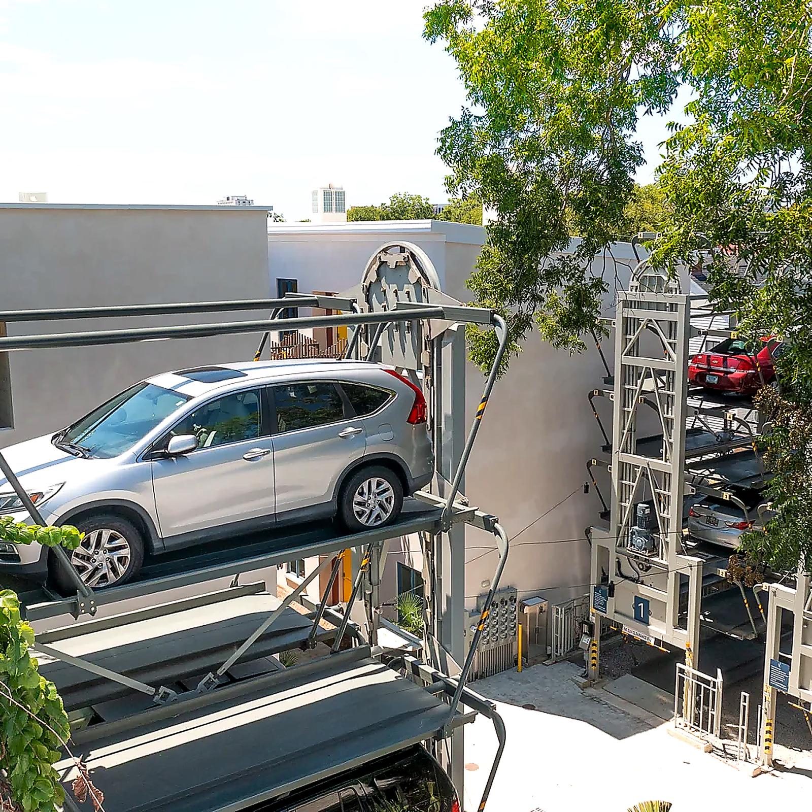 An SUV on the ground-level platform of a Charleston Carousel, ready to be lifted