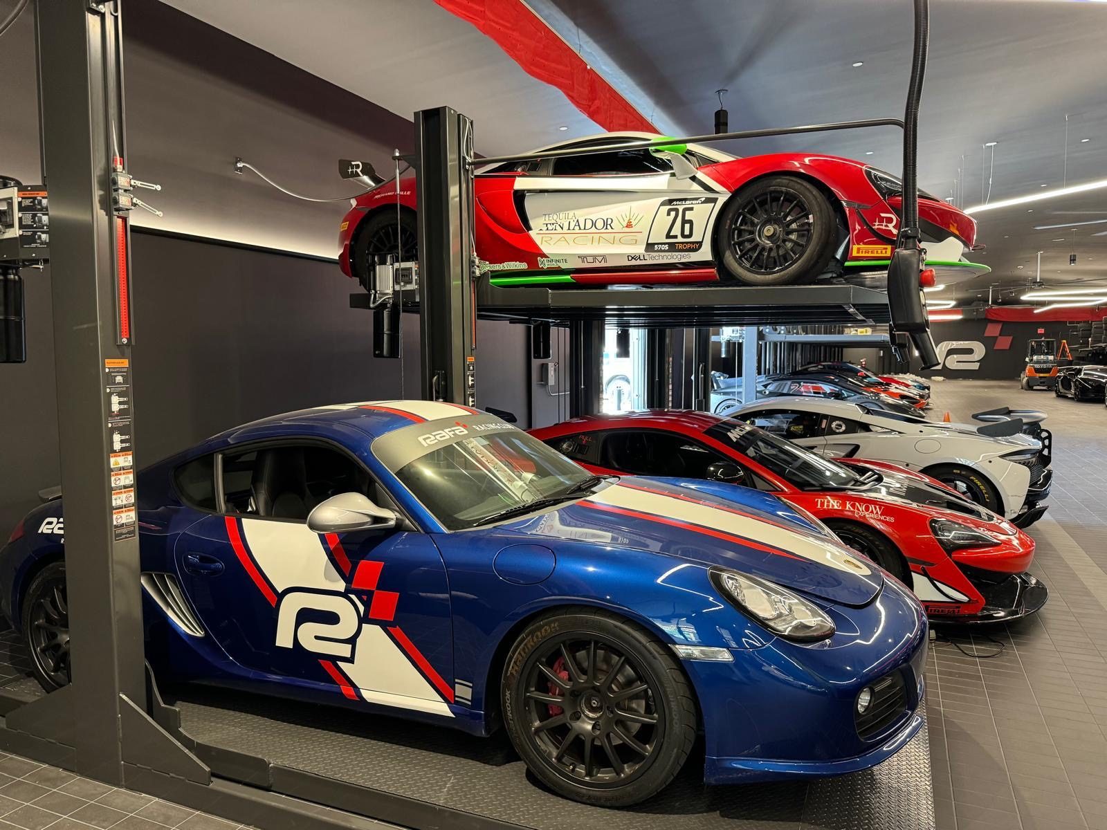 Race cars stored on Double Stackers in a motorsport showroom
