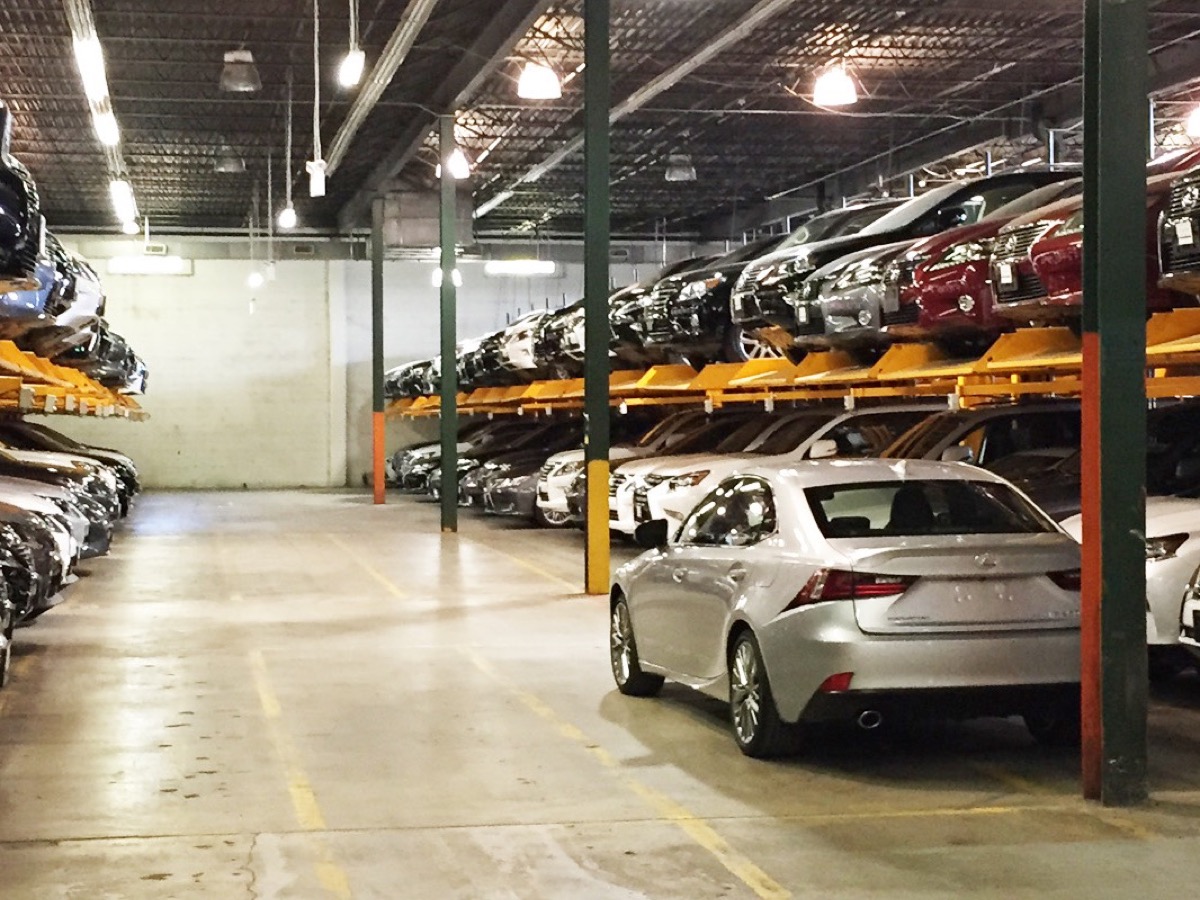 Double stackers holding two vehicles per position in a covered parking structure