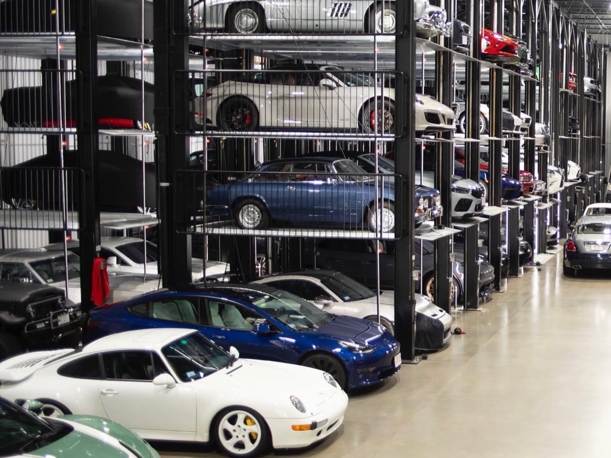 Quad stackers holding four vehicles per position in a collector storage facility