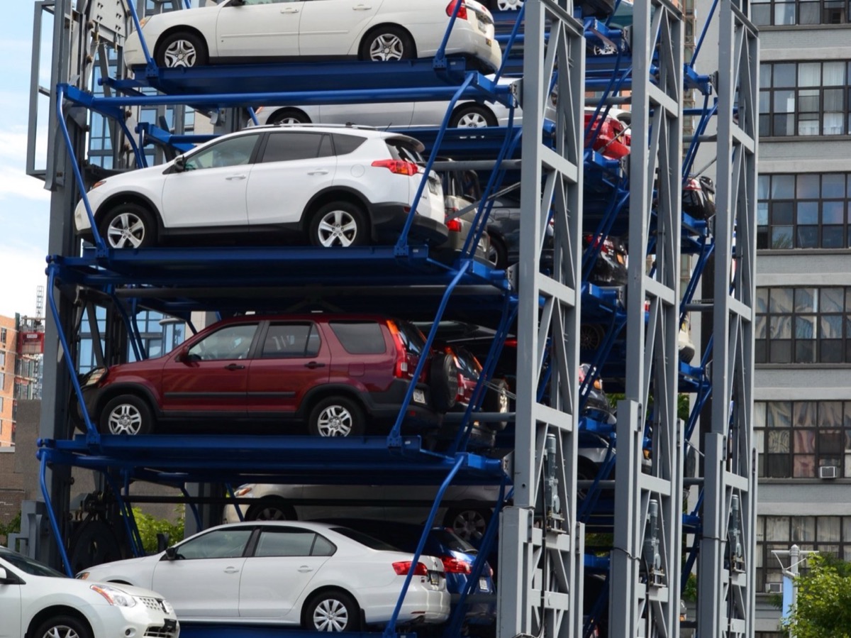 Tower parking system stacking vehicles vertically above a single ground-level entry