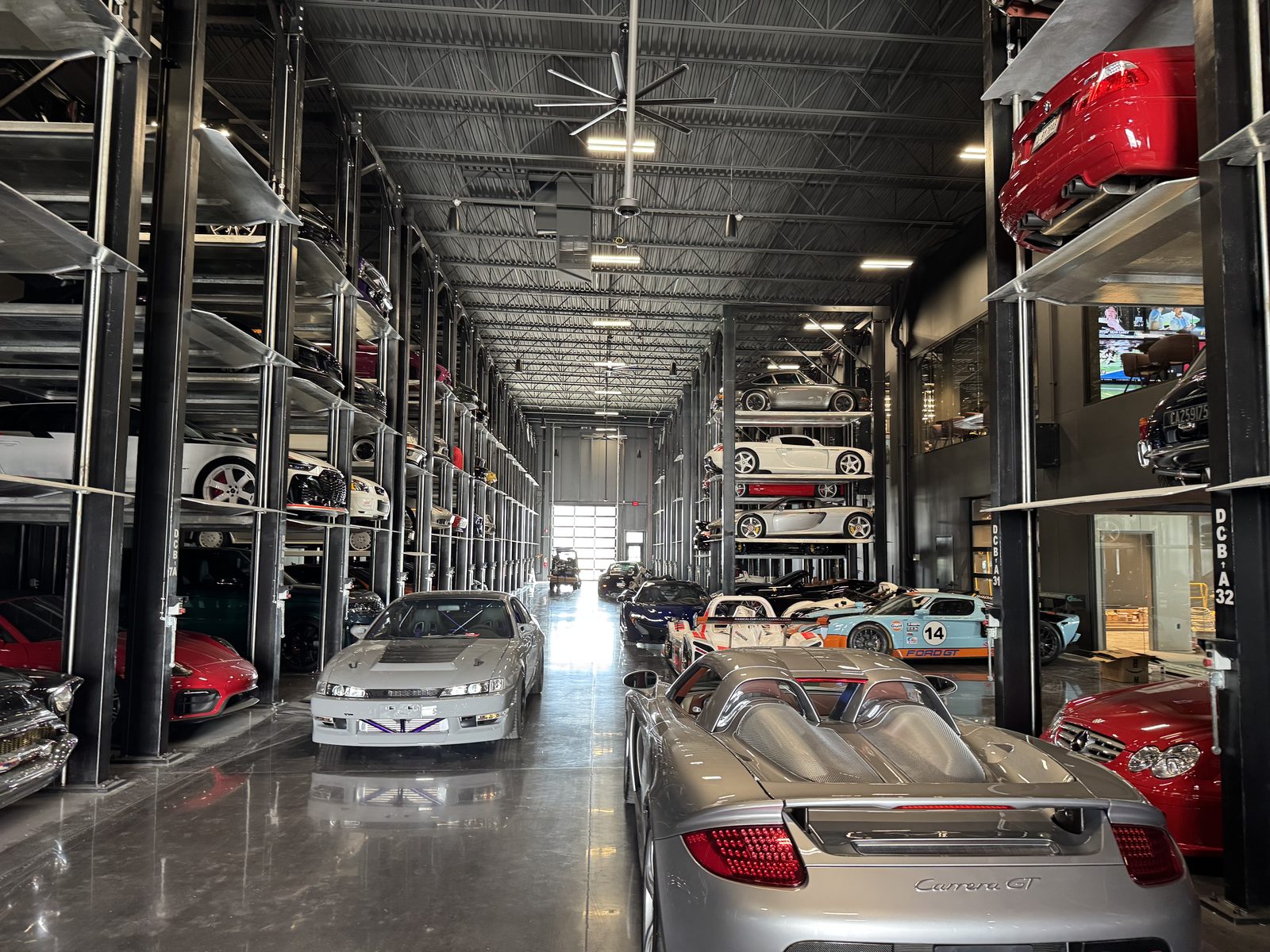 A long aisle of Quad Stackers in a collector warehouse in Acton