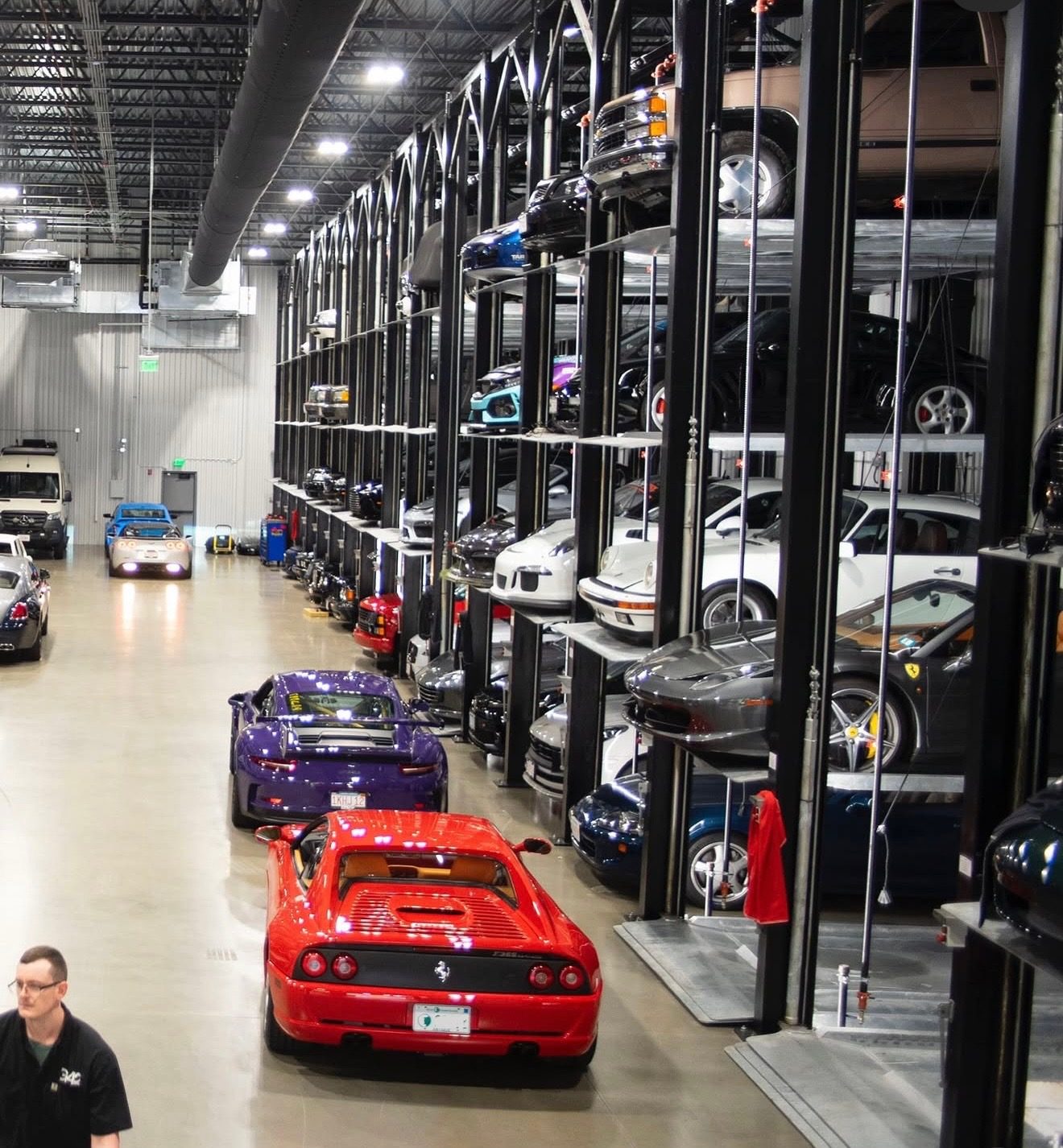 Quad Stackers along the wall of a vehicle storage facility in Acton