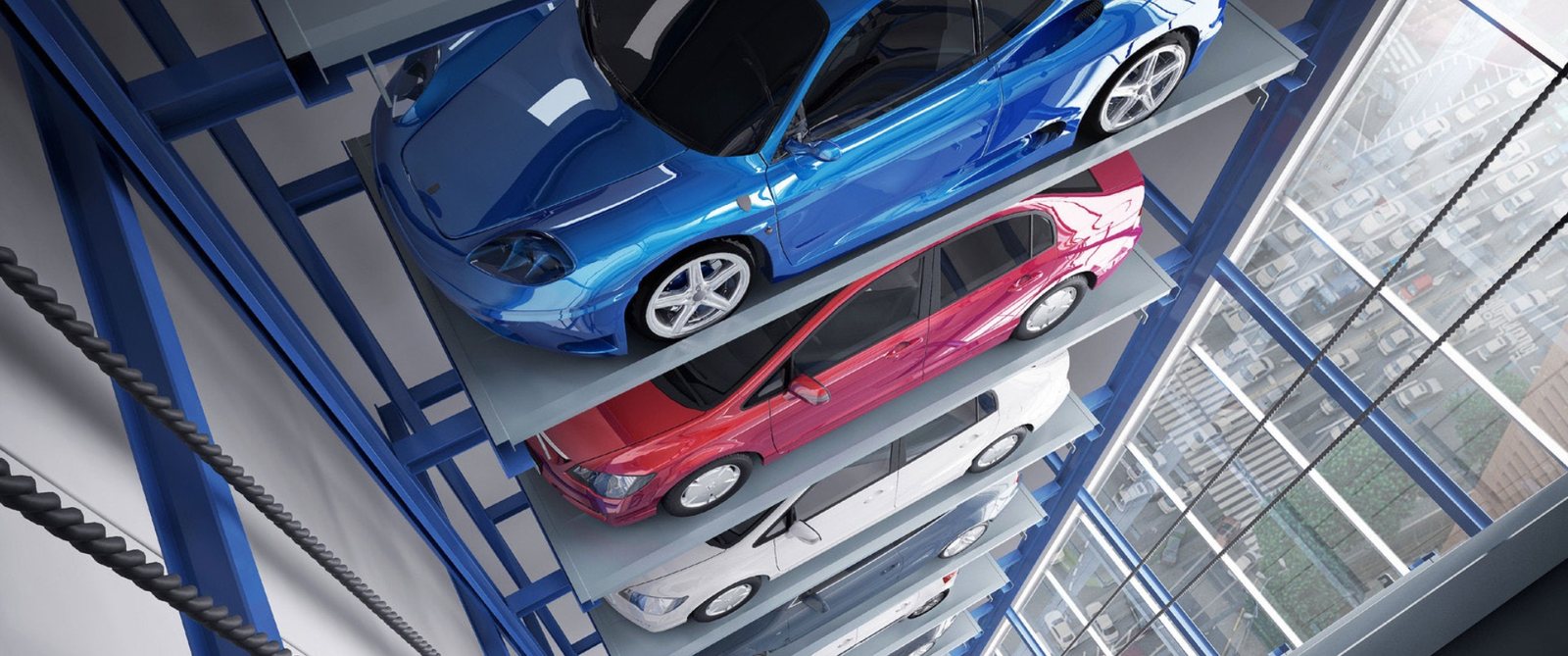 Looking up the inside of a Tower parking system with vehicles held on platforms either side of the lift shaft
